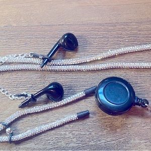 Retractable ID badge holder with attached  earbud holders